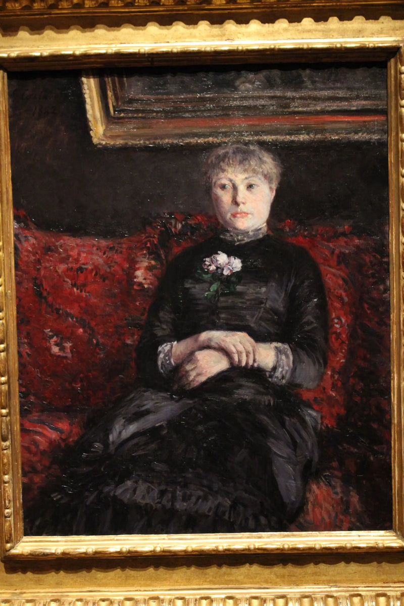 Vrouw zittend op een bank met rode bloemen - Gustave Caillebotte