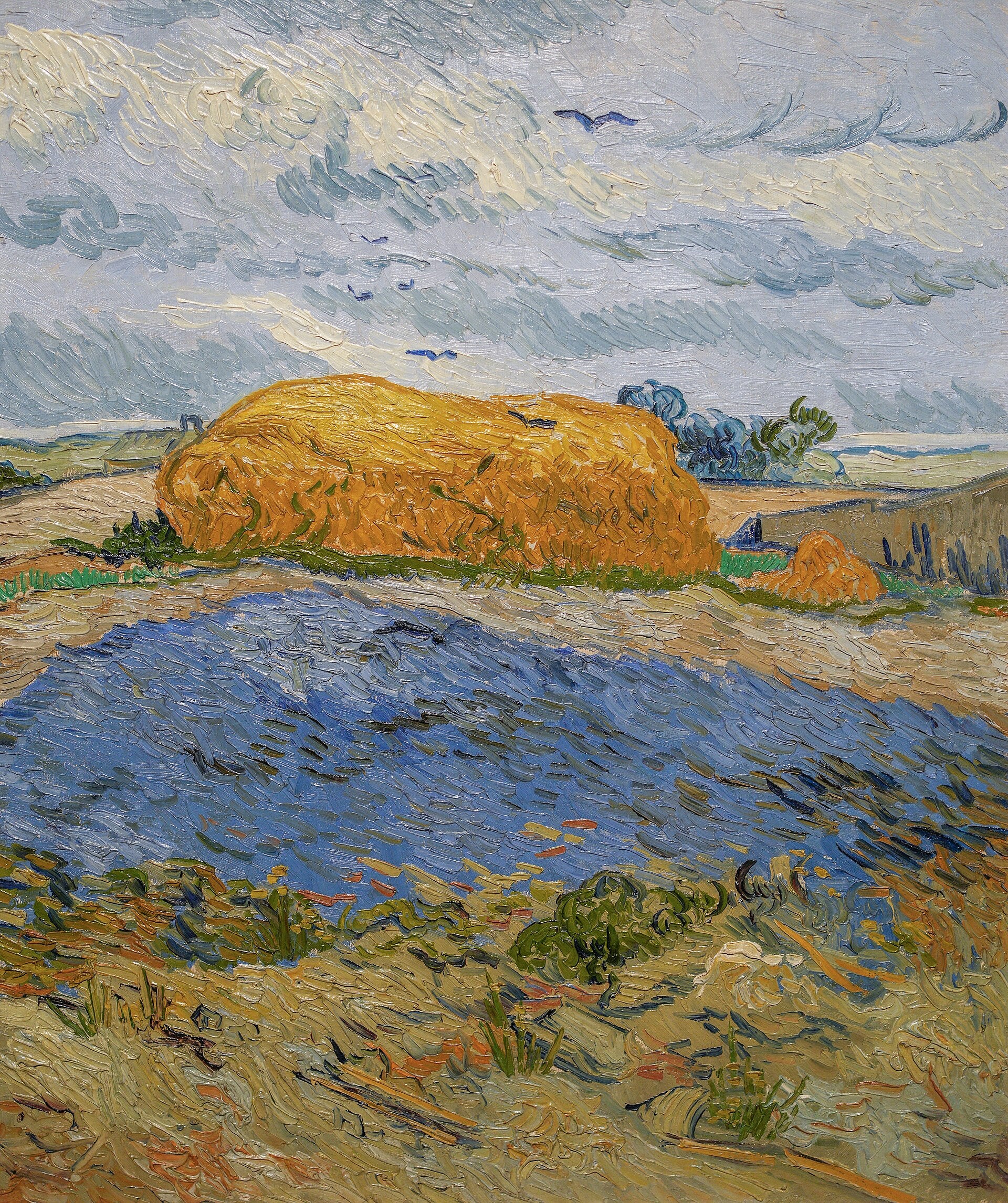 Hooiwallen onder een regenachtige hemel - Vincent van Gogh