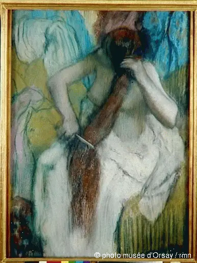 Vrouw die zich opmaakt - Edgar Degas