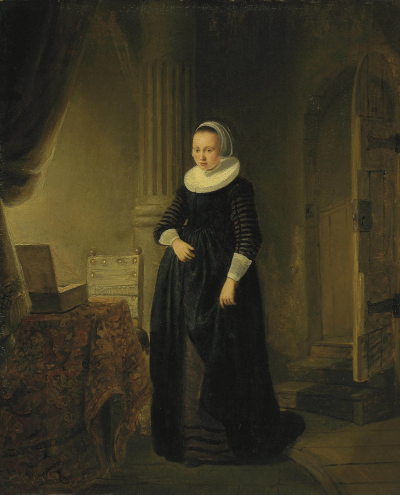 Portret van een vrouw, staand in een interieur - Rembrandt