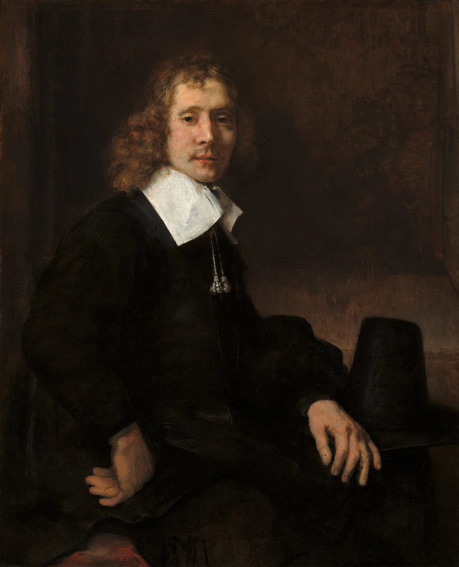 Een jonge man zittend aan een tafel (misschien Govaert Flinck) - Rembrandt