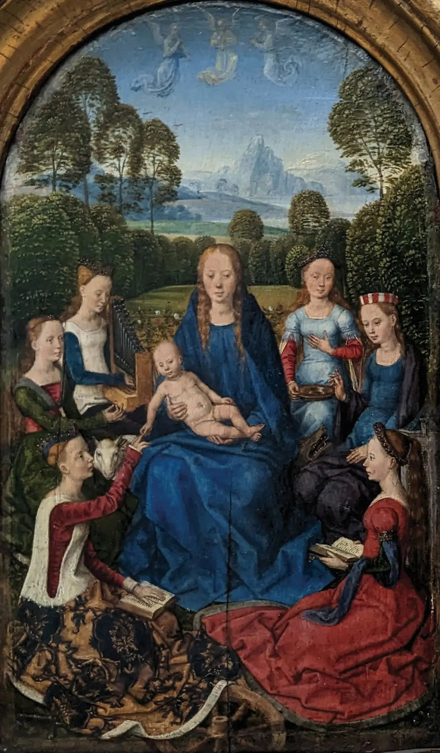 De Maagd en het kind omringd door heiligen - Hans Memling