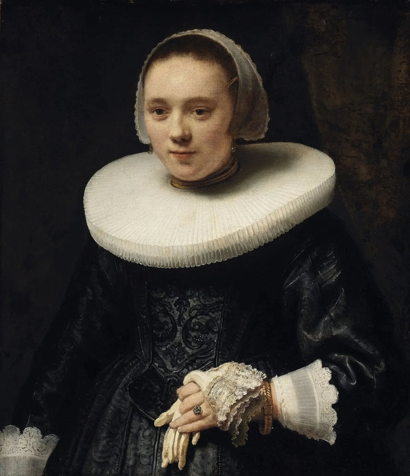 Portret van een vrouw met handschoenen - Rembrandt