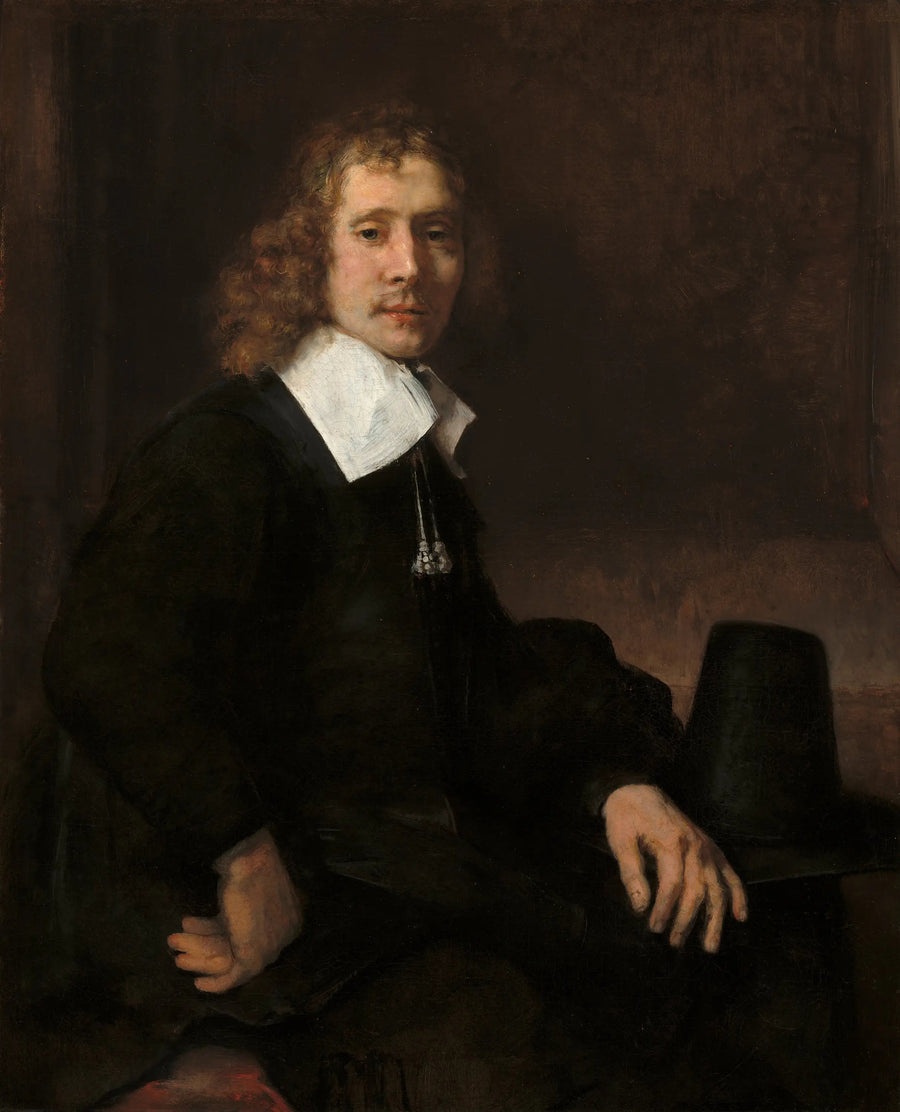 Een jonge man zittend aan een tafel (misschien Govaert Flinck) - Rembrandt